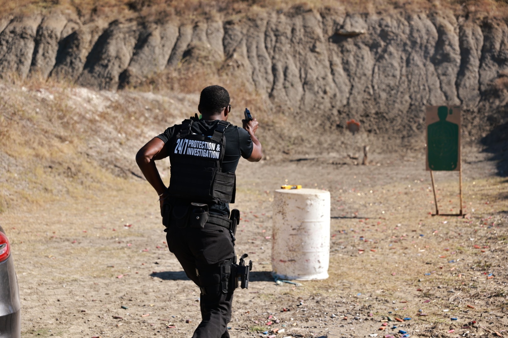 Security officer in shooting stance during firearms drill
