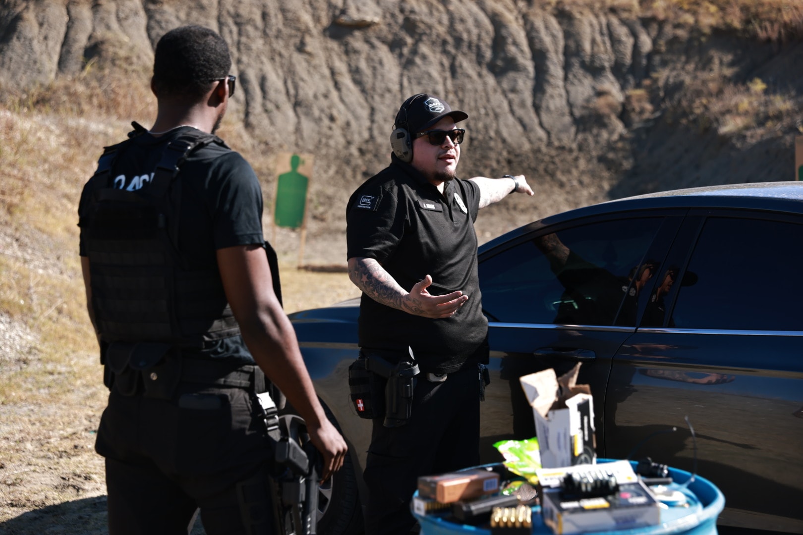 Instructor coaching student during security training drill