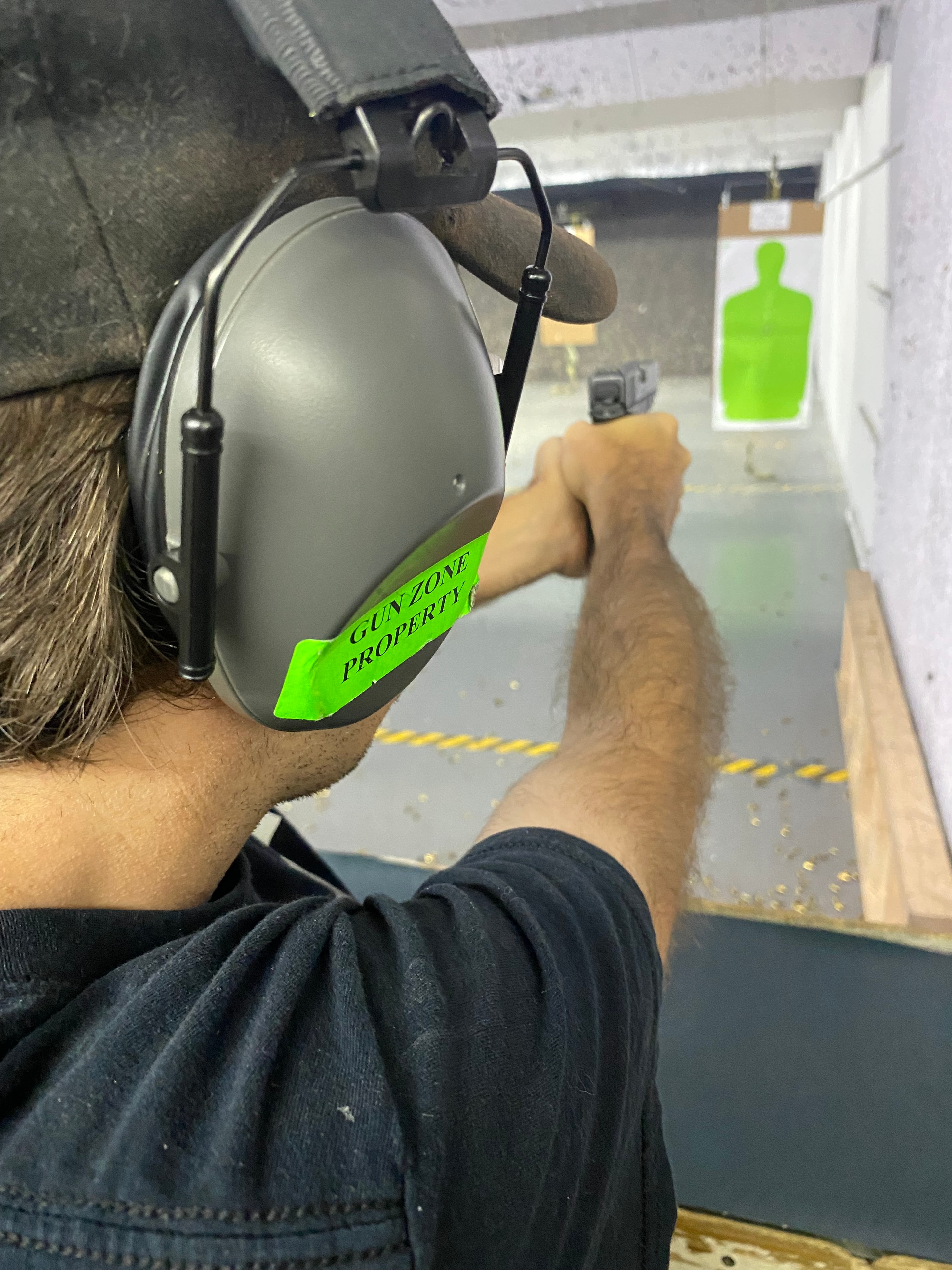 Student at indoor range during Level III firearms qualification