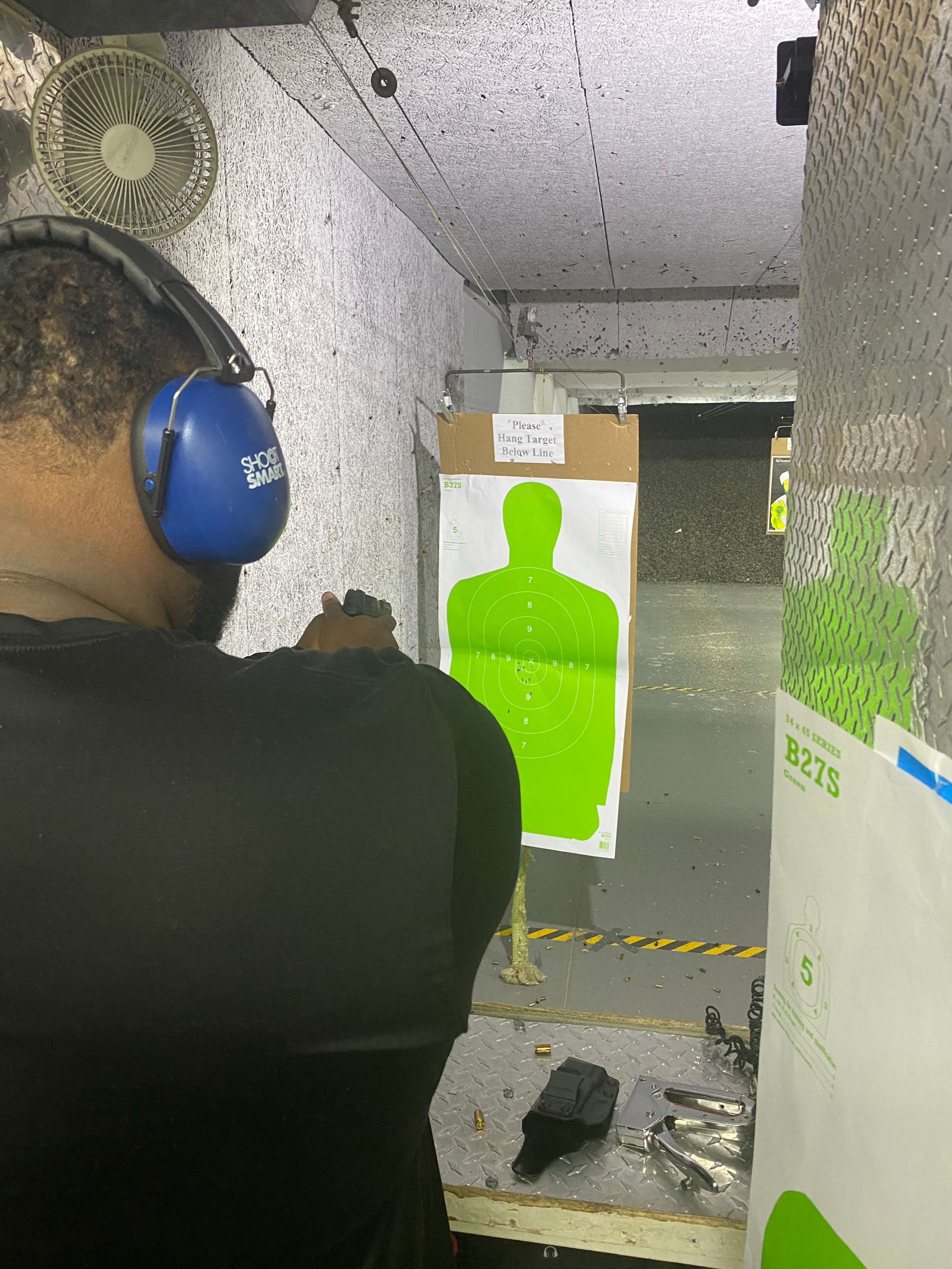 Level III student at shooting lane with green target